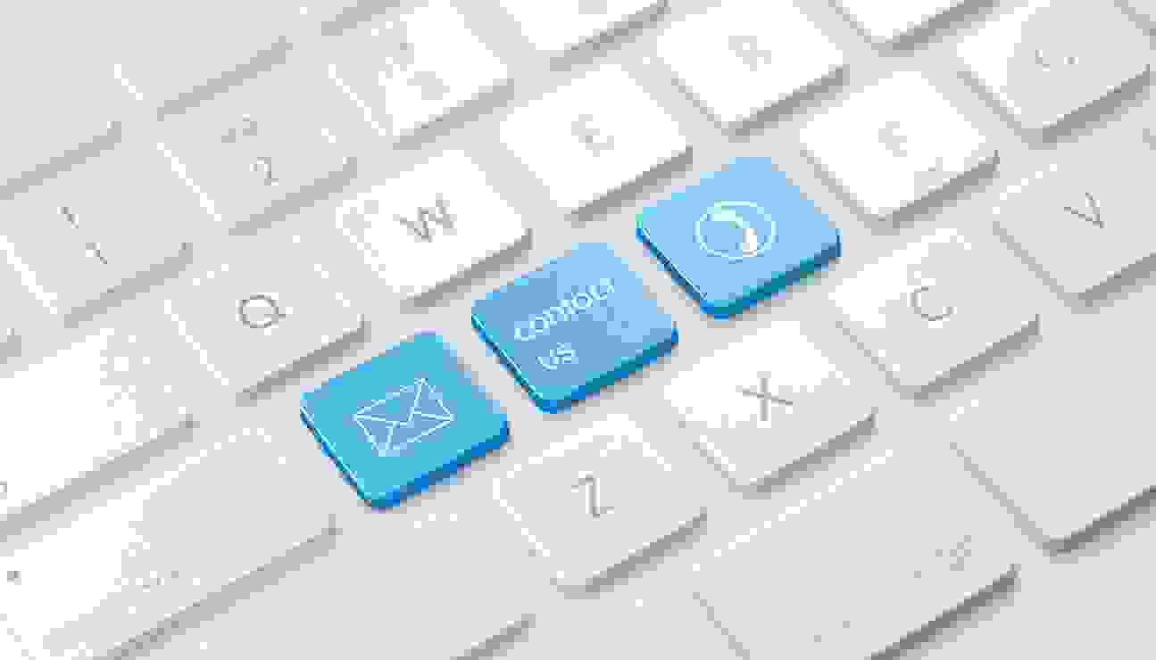 Close-up of keyboard with 'Contact us' written on one of the keys