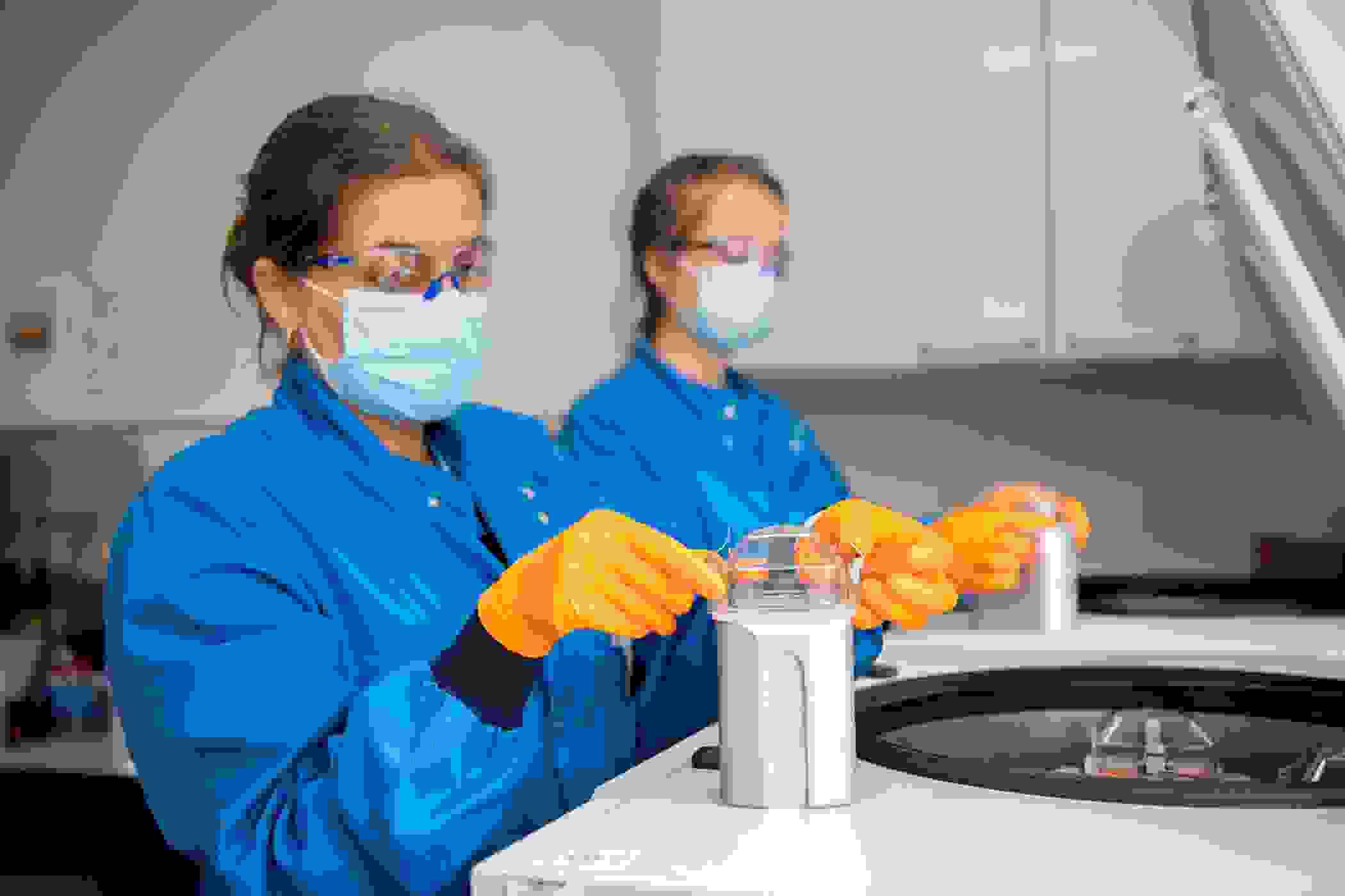 BioResource staff using Centrifuge machine for samples.